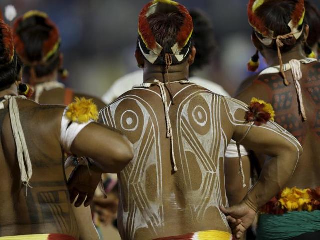 Indigenous men from the Kuikuru tribe watch a tug-of-war competition at the first World Games for Indigenous Peoples in Palmas, Brazil. (REUTERS) Indigenous men from the Kuikuru tribe watch a tug-of-war competition at the first World Games for Indigenous Peoples in Palmas, Brazil. (REUTERS)