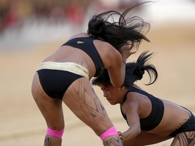 Indigenous women from the Kamayura tribe take part in a demonstration of the Huka Huka fight at the first World Games for Indigenous Peoples in Palmas, Brazil. (REUTERS) Indigenous women from the Kamayura tribe take part in a demonstration of the Huka Huka fight at the first World Games for Indigenous Peoples in Palmas, Brazil. (REUTERS)