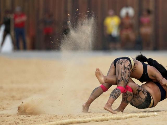 Indigenous women from the Kamayura tribe take part in a demonstration of the Huka Huka fight at the first World Games for Indigenous Peoples in Palmas, Brazil. (REUTERS) Indigenous women from the Kamayura tribe take part in a demonstration of the Huka Huka fight at the first World Games for Indigenous Peoples in Palmas, Brazil. (REUTERS)