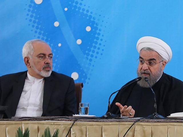 A handout photo provided by the office of Iranian President Hassan Rouhani (R) shows him sitting next to his foreign minister Mohammad Javad Zarif (L) during a meeting with foreign ambassadors and other top diplomats in Tehran. (AFP/HO/Iranian Presidency) A handout photo provided by the office of Iranian President Hassan Rouhani (R) shows him sitting next to his foreign minister Mohammad Javad Zarif (L) during a meeting with foreign ambassadors and other top diplomats in Tehran. (AFP/HO/Iranian Presidency)
