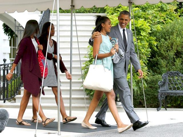 US President Barack Obama with his daughters Malia and Sasha. (AFP File Photo) US President Barack Obama with his daughters Malia and Sasha. (AFP File Photo)