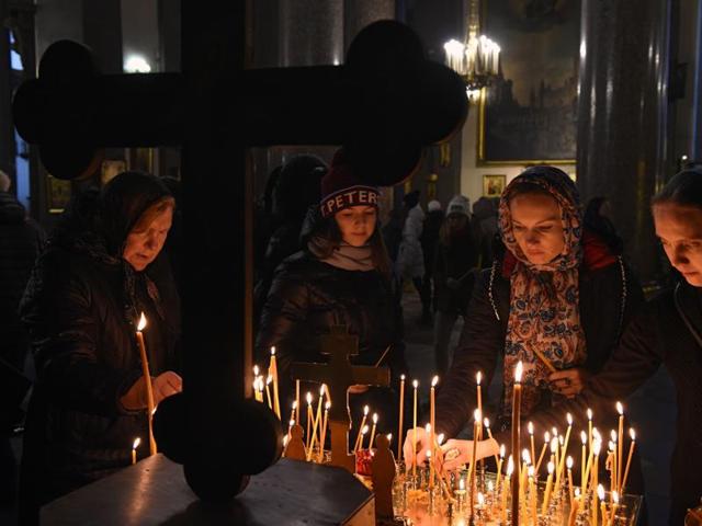 A woman reacts in central Saint Petersburg on Monday as people gather to light candles in memory of the victims of a jetliner crash. (AFP) A woman reacts in central Saint Petersburg on Monday as people gather to light candles in memory of the victims of a jetliner crash. (AFP)