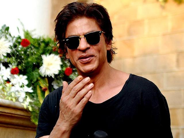 Shah Rukh Khan poses for a photograph during a photocall for his 49th birthday celebrations at his home in Mumbai on November 2, 2014.(AFP)