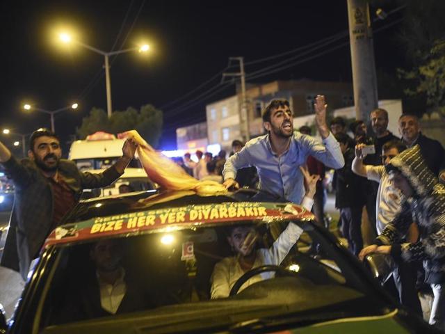 Supporters of Turkey's pro-Kurdish People's Democratic Party (HDP) celebrate in the southeastern city of Diyarbakir after polls closed. (AFP)