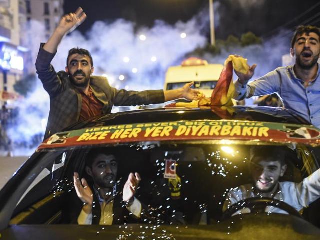 Supporters of Turkey's pro-Kurdish People's Democratic Party (HDP) celebrate in the southeastern city of Diyarbakir after polls closed. (AFP)