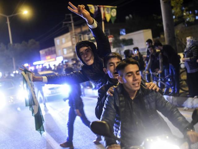 Supporters of Turkey's pro-Kurdish People's Democratic Party (HDP) celebrate in the southeastern city of Diyarbakir after polls closed . (AFP)