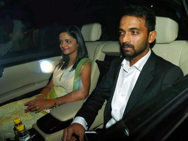 Cricketer Ajinkya Rehane with his wife arrives to attend wedding reception of Harbhajan Singh and Geeta Basra in New Delhi on Sunday. (PTI)