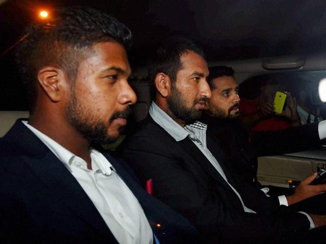 Cricketers Cheteshwar Arvind Pujara, Murli Vijay, Varun Raymond Aaron arrives to attend wedding reception of Harbhajan Singh and Geeta Basra in New Delhi on Sunday. (PTI)