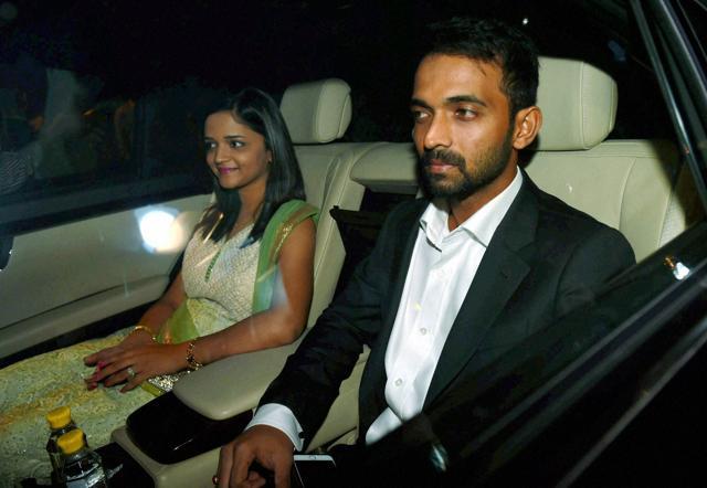 New Delhi: Cricketer Ajinkya Rehane with his wife arrives to attend wedding reception of Harbhajan Singh and Geeta Basra in New Delhi on Sunday. (PTI)