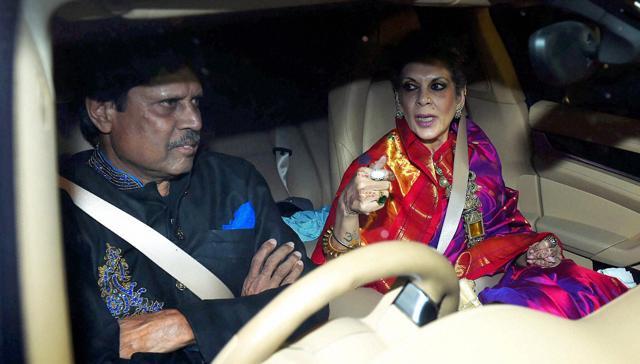 Former Cricketer Kapil Dev with his wife arrives to attend wedding reception of Harbhajan Singh and Geeta Basra in New Delhi on Sunday. (PTI)