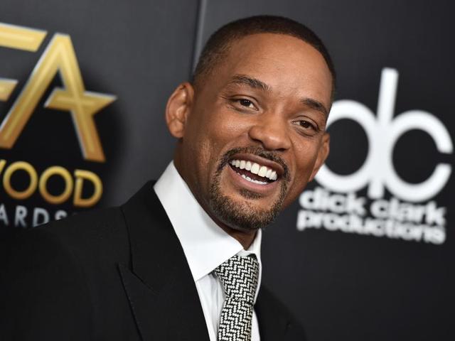Star Will Smith arrives at the Hollywood Film Awards at the Beverly Hilton Hotel with his new movie Concussion. (AP)