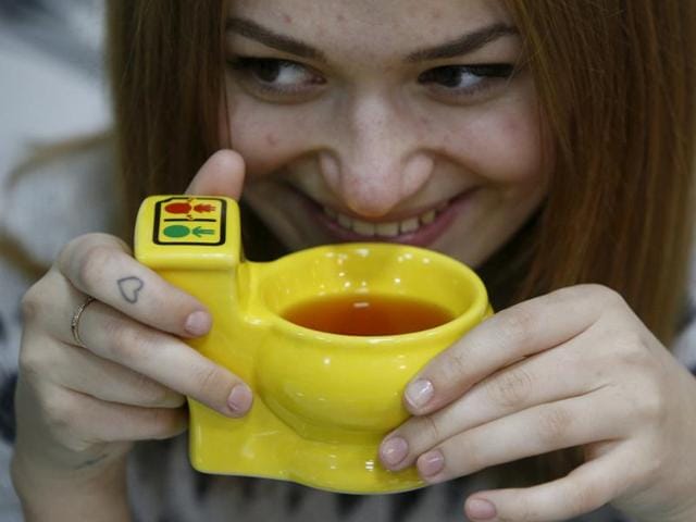 A new Moscow cafe, which opened on October 30, serves food to its guests with crockery designed like small baths and urinals, in toilet-themed interior with seats resembling toilets. (REUTERS)