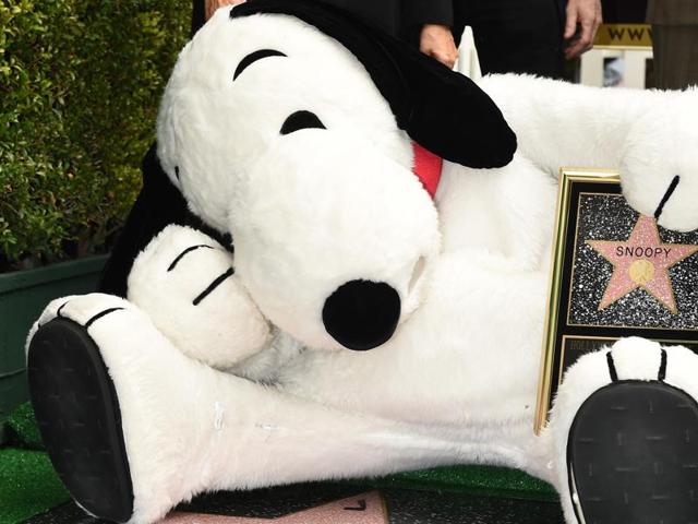 Snoopy poses on his star at the unveiling ceremony on the Hollywood Walk of Fame. Snoopy co-stars with Charlie Brown and Lucy in The Peanuts Movie which opens in the US on November 6. (AFP)