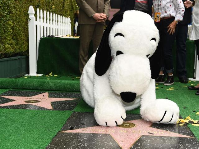 Snoopy visits the star of his creator Charles M Schulz during the unveiling ceremony for Snoopy's star on the Hollywood Walk of Fame. (AFP)