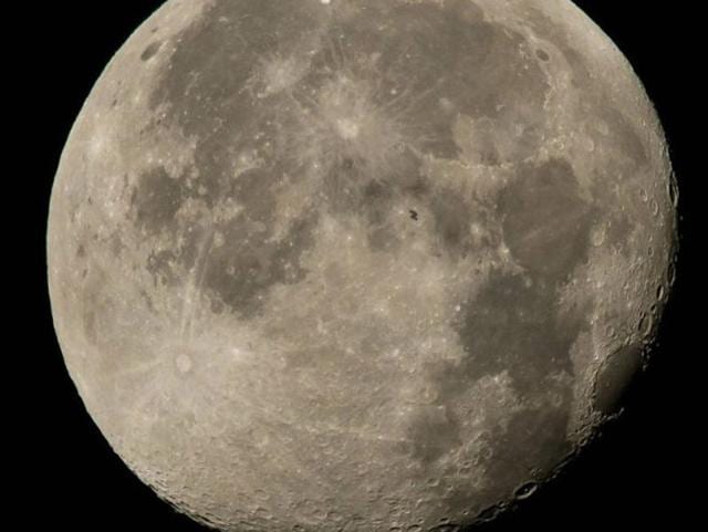 The International Space Station, with a crew of six onboard, is seen in silhouette as it transits the moon at roughly five miles per second, Sunday, Aug. 2, 2015, Woodford, VA. (Photo courtesy: nasa.gov)