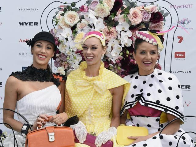 Fashions on the Field contestants are seen before the race at the Melbourne Cup. (AP)