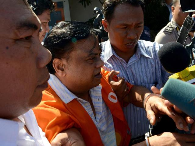 Rajendra Sadashiv Nikalje, 55, known in India as Chhota Rajan, is brought out from a holding cell at the Bali police headquarters in Denpasar on Bali island. (AFP) Rajendra Sadashiv Nikalje, 55, known in India as Chhota Rajan, is brought out from a holding cell at the Bali police headquarters in Denpasar on Bali island. (AFP)
