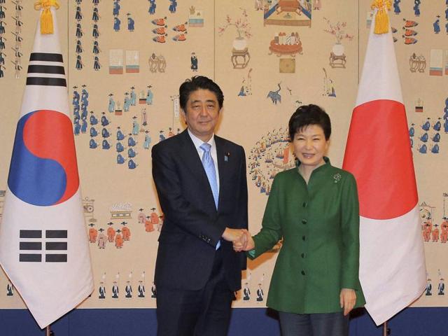 South Korean President Park Geun-hye, right, and Japanese Prime Minister Shinzo Abe pose for photos before their meeting at the presidential Blue House in Seoul. (AP/PTI Photo) South Korean President Park Geun-hye, right, and Japanese Prime Minister Shinzo Abe pose for photos before their meeting at the presidential Blue House in Seoul. (AP/PTI Photo)
