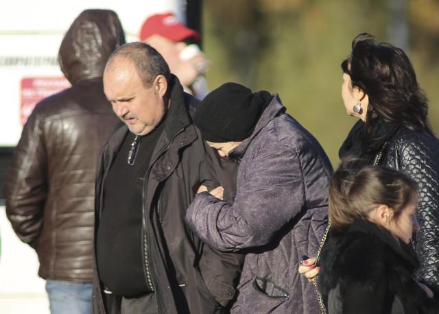 People walk at a compound where relatives of those killed in an air crash in Egypt are gathering for the identification of remains at a morgue in St. Petersburg, Russia. (Reuters Photo) People walk at a compound where relatives of those killed in an air crash in Egypt are gathering for the identification of remains at a morgue in St. Petersburg, Russia. (Reuters Photo)