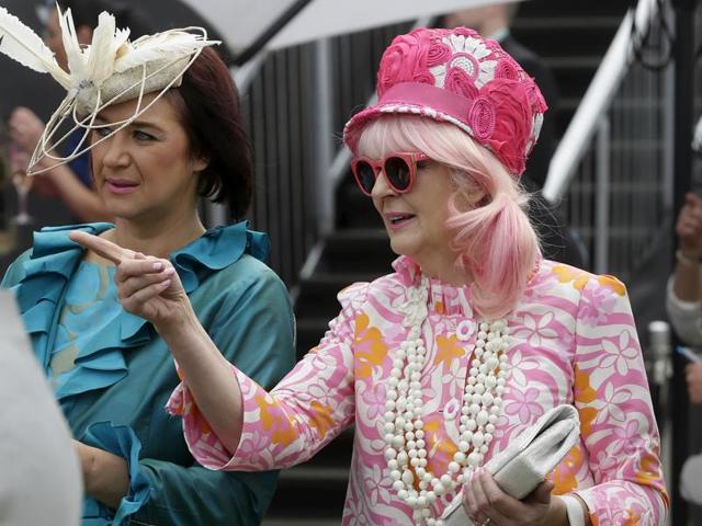 Racegoers dressed up during the Melbourne Cup race day at Flemington Racecourse. (REUTERS)