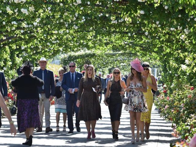 Racegoers enter Flemington Racecourse on Melbourne Cup day. (AFP Photo)