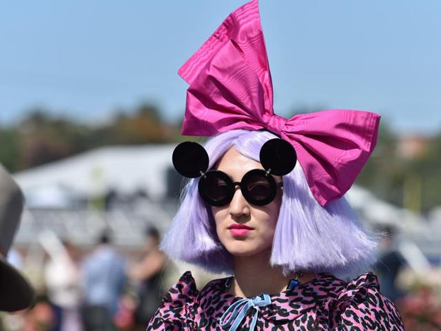 A racegoer prepares for the annual Fashion on the Field competition at the Melbourne Cup. (AFP)