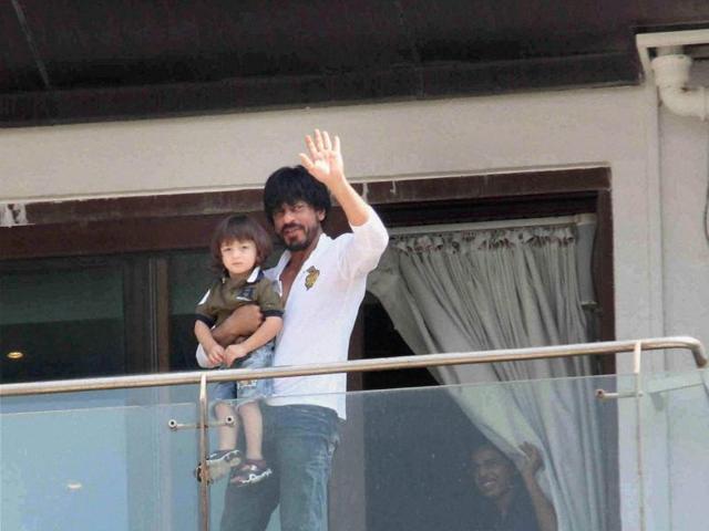 Shah Rukh Khan waves to fans and well-wishers gathered outside his residence to greet him on his 50th birthday . (PTI) Shah Rukh Khan waves to fans and well-wishers gathered outside his residence to greet him on his 50th birthday . (PTI)