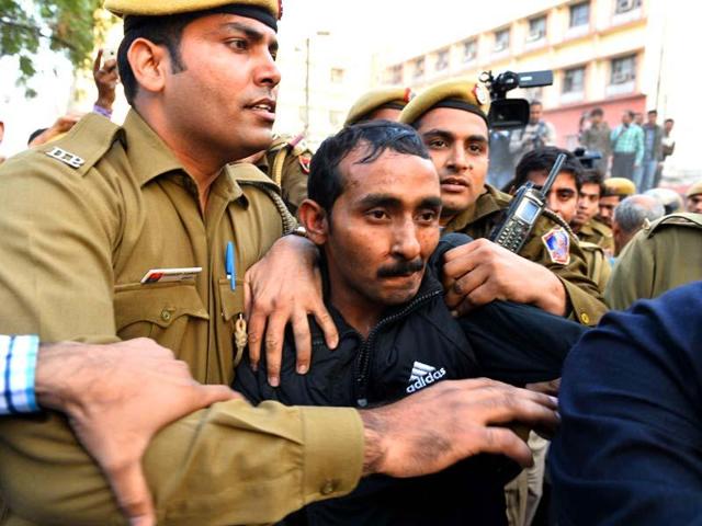Police escort Uber taxi driver Shiv Kumar Yadav. (AFP Photo) Police escort Uber taxi driver Shiv Kumar Yadav. (AFP Photo)