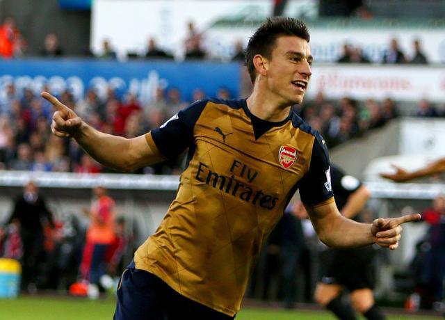 Arsenal's French defender Laurent Koscielny celebrates after scoring their second goal during the English Premier League football match between Swansea City and Arsenal at The Liberty Stadium in Swansea, south Wales. (AFP Photo) Arsenal's French defender Laurent Koscielny celebrates after scoring their second goal during the English Premier League football match between Swansea City and Arsenal at The Liberty Stadium in Swansea, south Wales. (AFP Photo)