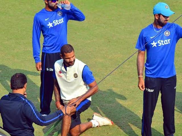 Shikhar Dhawan exercises during a practice session ahead of the first Test match against South Africa .
