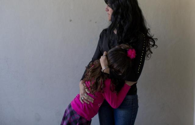 Luana embraces her mother Gabriela Mansilla at home in Merlo, Argentina. (AP)