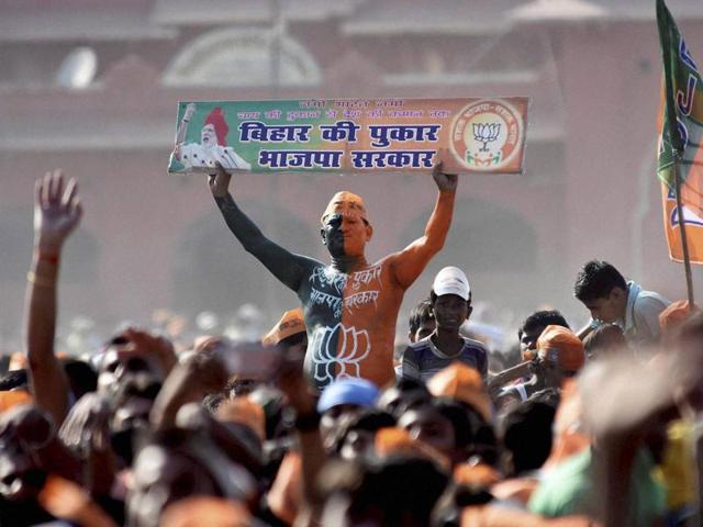 A BJP supporter during an election rally in Darbhanga on Monday. (PTI)
