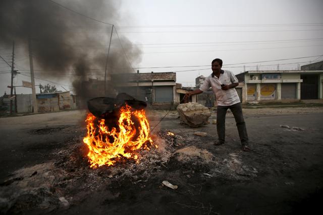 Madhesi protestors throw stones and bricks at Nepalese policemen in Birgunj. (AP Photo) Madhesi protestors throw stones and bricks at Nepalese policemen in Birgunj. (AP Photo)