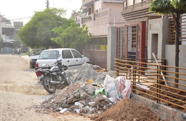 Construction material dumped outside a house in Panchkula on Tuesday. (Sant Arora/HT Photo)