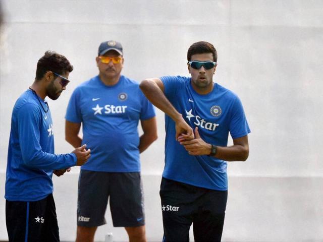 India's team director Ravi Shastri looks on as Ravichandran Ashwin, Amit Mishra and Ravindra Jadeja practice bowling in the nets ahead of the first Test match against South Africa at Mohali on Tuesday. (PTI)