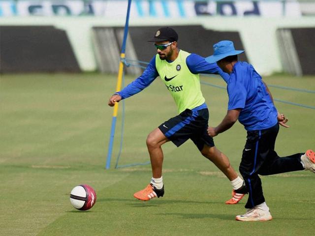 Virat Kohli playing football during a practice session ahead of the first Test match against South Africa at Mohali on Tuesday. (PTI)
