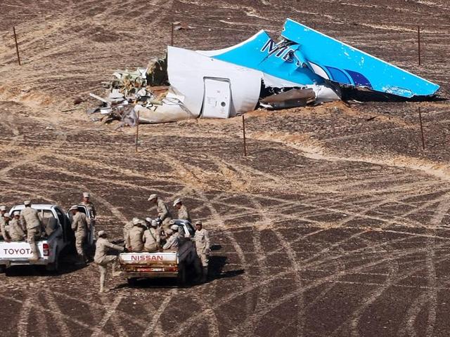 In this photo provided by Russian Emergency Situations ministry, Egyptian military approach the plane's tail at the wreckage of a passenger jet bound for St Petersburg in Russia that crashed in Hassana, Egypt. (AP Photo) In this photo provided by Russian Emergency Situations ministry, Egyptian military approach the plane's tail at the wreckage of a passenger jet bound for St Petersburg in Russia that crashed in Hassana, Egypt. (AP Photo)