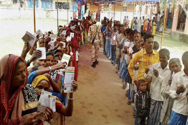 Voters waiting in a queue to cast their votes during the fifth phase of Bihar elections in Madhepura. (PTI)