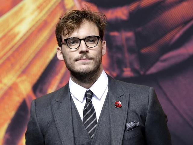 Actor Sam Claflin, who plays Finnick Odair poses at the red carpet premiere of The Hunger Games: Mockingjay - Part 2. (AP)