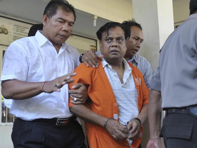 Chhota Rajan is brought out from a holding cell at the Bali police headquarters in Denpasar on Bali island. The notorious Mumbai don was arrested after more than two decades on the run.(AFP Photo)