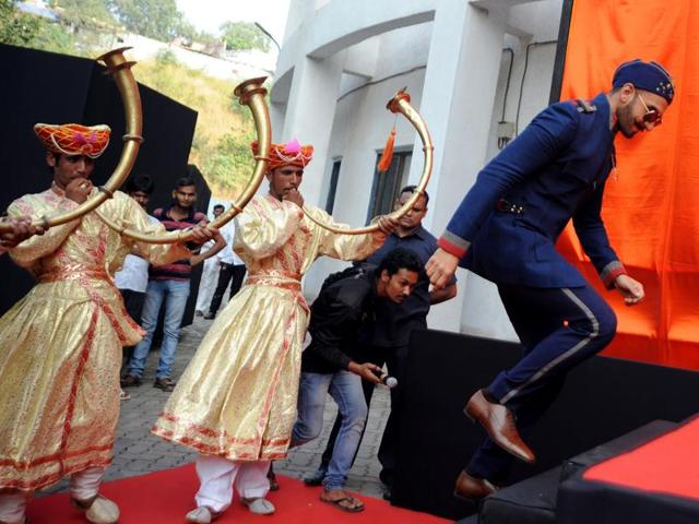 Ranveer Singh gets up on the stage for the poster launch of Bajirao Mastani in Mumbai on November 4, 2015. (AFP)