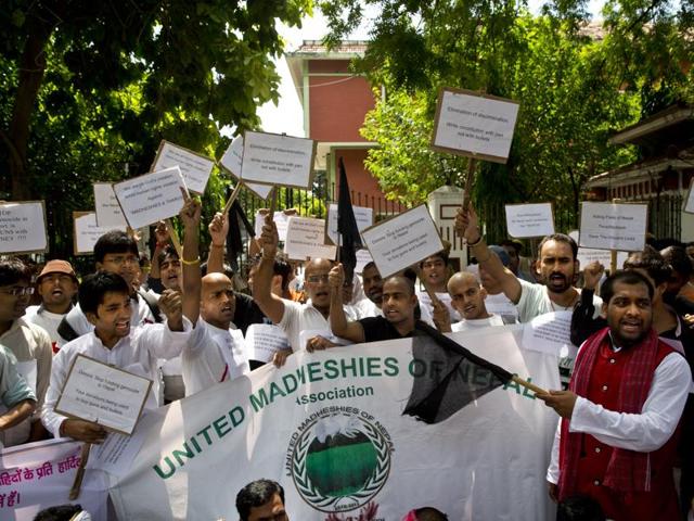 Nepalese men, mostly from Madhesi community, protest against the new Constitution outside the Nepalese embassy in New Delhi, India. In an unprecedented move, India has slammed Nepal for human rights violations at the UN.(AP) Nepalese men, mostly from Madhesi community, protest against the new Constitution outside the Nepalese embassy in New Delhi, India. In an unprecedented move, India has slammed Nepal for human rights violations at the UN.(AP)