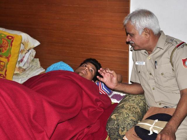 A cop talking to Gaurav at the latter’s house in Panchkula on Wednesday. (Sant Arora/HT Photo) A cop talking to Gaurav at the latter’s house in Panchkula on Wednesday. (Sant Arora/HT Photo)
