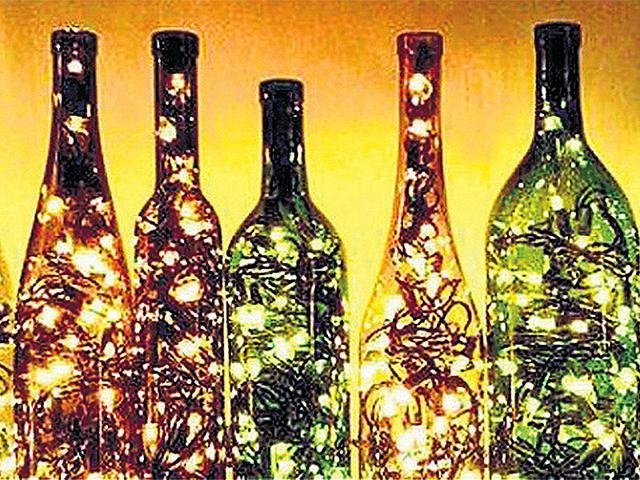 Take tall wine bottles or mason jars that can be filled with miniature fairy lights . (IMAGESBAZAAR) Take tall wine bottles or mason jars that can be filled with miniature fairy lights . (IMAGESBAZAAR)