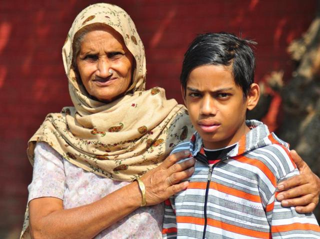 Vishal Sharma with his grandmother at PGIMER , Chandigarh.(Karun Sharma /HT)