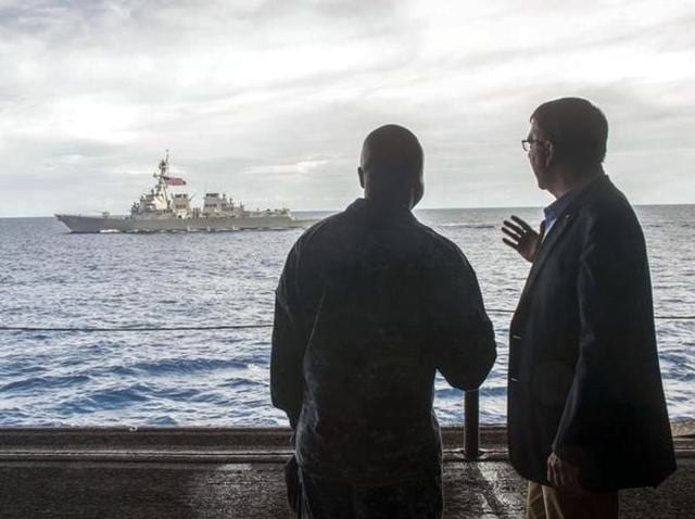 US secretary of defense Ash Carter (R) speaks with US Navy Cmdr Robert C Francis Jr, as Carter and Malaysian defense minister Hishammuddin Hussein (Not Pictured) visited the USS Theodore Roosevelt aircraft carrier in the South China Sea. (REUTERS/Senior Master Sgt. Adrian Cadiz/Department of Defense Handout) US secretary of defense Ash Carter (R) speaks with US Navy Cmdr Robert C Francis Jr, as Carter and Malaysian defense minister Hishammuddin Hussein (Not Pictured) visited the USS Theodore Roosevelt aircraft carrier in the South China Sea. (REUTERS/Senior Master Sgt. Adrian Cadiz/Department of Defense Handout)