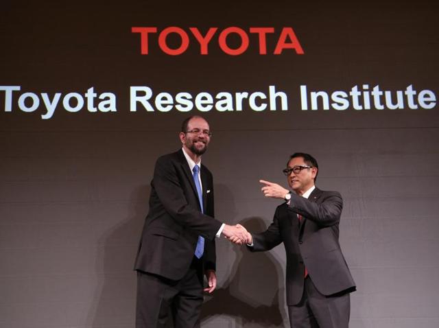Toyota Motor Corp.'s executive technical advisor Gill Pratt, left, and president Akio Toyoda, right, shake hands during a press conference on artificial intelligence in Tokyo. (AP Photo) Toyota Motor Corp.'s executive technical advisor Gill Pratt, left, and president Akio Toyoda, right, shake hands during a press conference on artificial intelligence in Tokyo. (AP Photo)