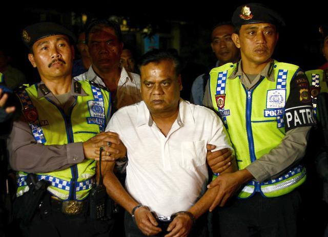 Indonesian police escort Rajendra Sadashiv Nikalje, 55, known as Chhota Rajan, (C) from Bali police headquarters to Ngurah Rai Airport during his deportation from Denpasar on Bali island. (AFP Photo) Indonesian police escort Rajendra Sadashiv Nikalje, 55, known as Chhota Rajan, (C) from Bali police headquarters to Ngurah Rai Airport during his deportation from Denpasar on Bali island. (AFP Photo)