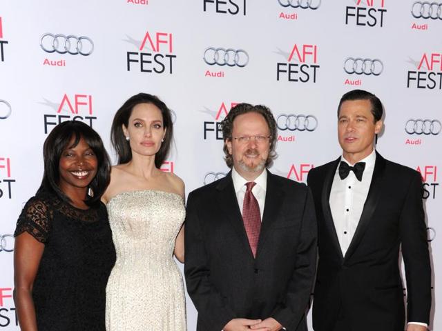 AFI Fest director Jacqueline Lyanga, from left, Angelina Jolie, AFI president and CEO Bob Gazzale and Brad Pitt arrive at the 2015 AFI Fest opening night premiere of By The Sea. (Richard Shotwell/Invision/AP) AFI Fest director Jacqueline Lyanga, from left, Angelina Jolie, AFI president and CEO Bob Gazzale and Brad Pitt arrive at the 2015 AFI Fest opening night premiere of By The Sea. (Richard Shotwell/Invision/AP)