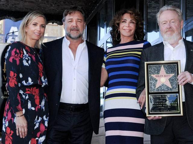 Actor Kristen Wiig, Russell Crowe, Giannina Facio and director Ridley Scott attend a ceremony honouring Scott with a star on the Hollywood Walk of Fame. (AP)